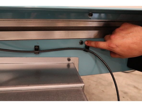 Once the head is tightly secured onto the head shipping block, use a 6 MM Socket to lock down the X Axis gibs tightly.