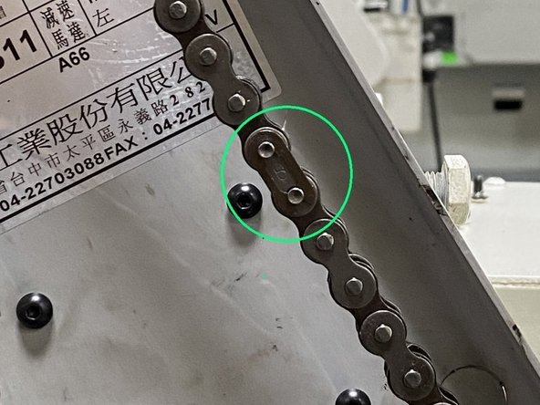 With the tension from the chain removed, locate the master link and remove it, then remove the chain from the sprockets.