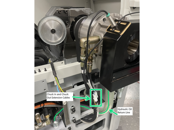 Photo 1 illustrates the Coolant Collector removed to show the gasket, lock ring and actuator. Collector must be installed before the lock ring and actuator in order to install and tighten the coolant collector mounting screws.