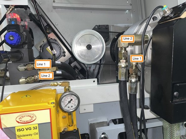 Attach hydraulic lines one(1) and two(2) from the solenoid valve to the hydraulic cylinder as shown in photo 1.