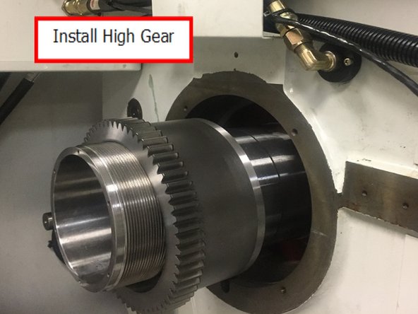 Install high gear onto the spindle and slide through the casting and align high gear with the drive key and seat against low gear.  Once high gear is in place install the spacer.