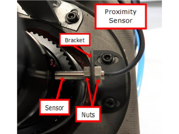 Assemble proximity sensor as shown. use two bolts to fasten bracket to casting in front of the spindle as shown. Gap between the spindle and edge of sensor should be 0.030&quot;. Rotate the spindle and make sure the light comes on and off. This will check the gap for proper operation of the sensor.