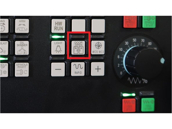 Press [DOOR OPEN] button on the MCP.