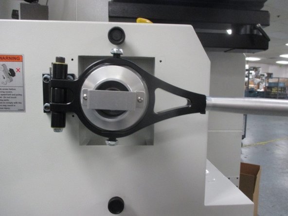 Disengage the collet closer and position the handle parallel to the head stock. Looking from the rear of the spindle, adjust the pivot screws such that the bearing body is concentric with the arbor. Do not over tighten the pivot screws.