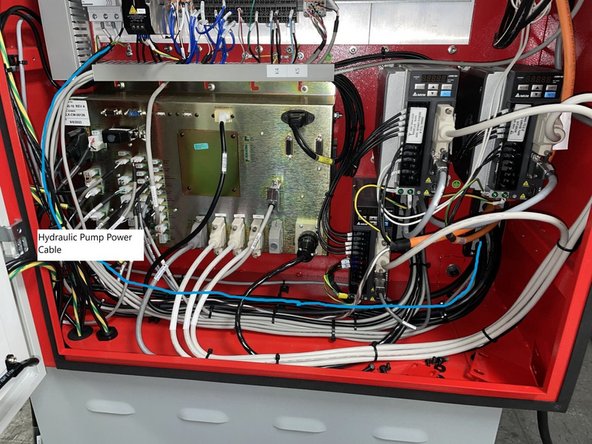 Route the Hydraulic pump power cable (29032-238) from Q13 down and along the floor with the other high power cables to the right rear corner of the cabinet. See Photo 3.