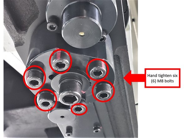 Before raising the arm for final alignment with the center of the tool flange, snug up the M8 screws around the M12 screw to make sure that arm is firmly fixed on the shaft.