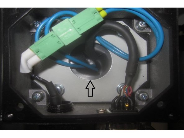 Carefully lift off the cover guiding the fan and encoder wires through the junction box rubber grommet.
