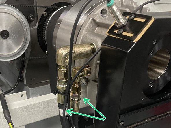 Reinstall the oil and coolant return lines.