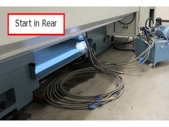 Tie wrap the hoses, coolant line and turret logic cable together so the far ends are about the same length. Start feeding from the rear near the spindle end of the lathe.