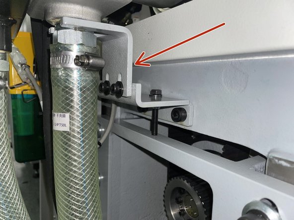Install the anti-rotation bracket to the spindle motor belt tension bracket. Adjust the height of the anti-rotation bracket to allow the hydraulic cylinder to move side to side, the anti-rotation bracket must not be tight on the hydraulic cylinder otherwise it will fail. See Photo 1.