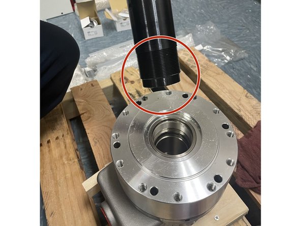 Clean the threads on both ends of the draw tube and inside of the hydraulic cylinder. Put a small amount of Vibra-Tight on the end of the draw tube with the shoulder, then install it into the hydraulic cylinder. See Photo 1. Tighten draw tube into cylinder with a chain or strap wrench