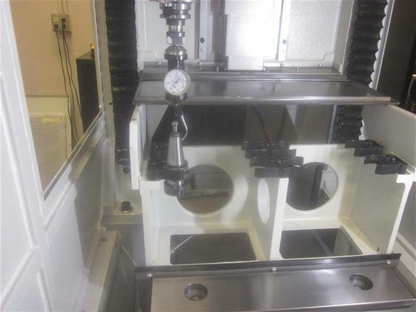 Re-assemble the ATC air cylinder. Install the ATC door, including the door assist brackets. Connect the air. Check the distance the ATC travels by noting its position during &quot;Tool Loading&quot;, and service code 520. Also, check that it fully closes when retracted. Adjust as necessary.