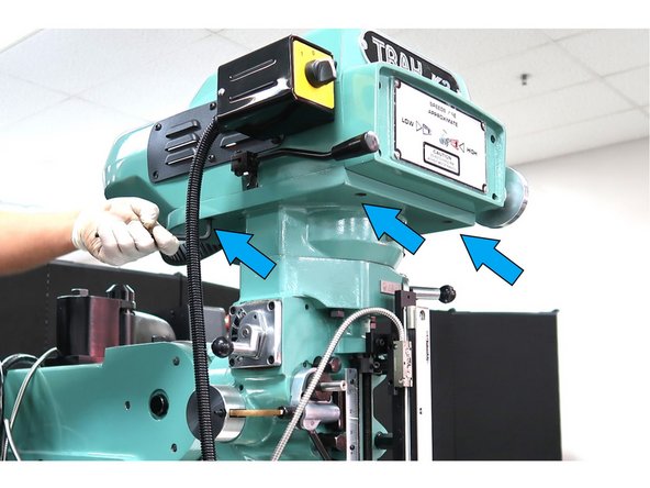 Remove 6 M8 SHCS, from the upper head cover three of which are shown.