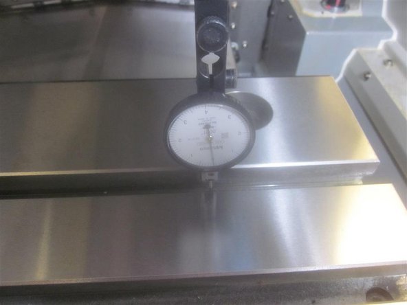 Set up the indicator to touch off the front wall of the &quot;T&quot; slot. Use the ball locks as a reference.