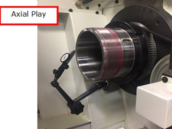 Set up a .0001” dial indicator on the back of the spindle shaft to check if there is any axial play in the spindle as the front bearing preload applied by the tailstock quill is released. While holding the spindle from rotating, unlock the tailstock quill and slowly pull it back.