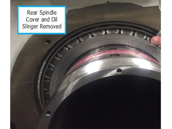Thread in 32005 forcing screw to remove the encoder pulley. Once the pulley is removed, remove the exposed key from the spindle. Remove encoder pulley assistive tooling and set aside. It will be used again later.