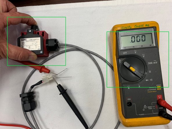 Set the voltmeter in continuity mode as shown.  Note that the voltmeter reads &quot;OL&quot; which means no continuity.