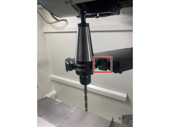 The tools can be removed from the ATC arm by pushing in the gripper on the arm if the arm is in the up position.