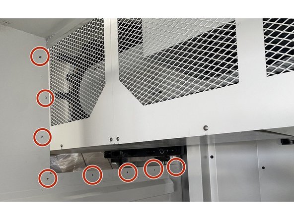 Using a Philips Head Screwdriver remove the eight (8) screws holding the sheet metal cover behind the ATC assembly.