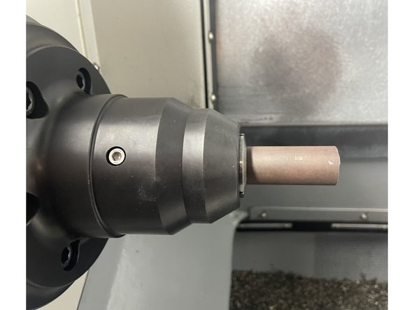 Take note of where the keyway on the collet is located. Use the collet tool to install the collet and thread into draw tube adapter until collet angle contacts angle in collet chuck. Continue to thread collet into draw tube adapter until the keyway in the collet lines up with one of the tapped holes in the collet chuck.