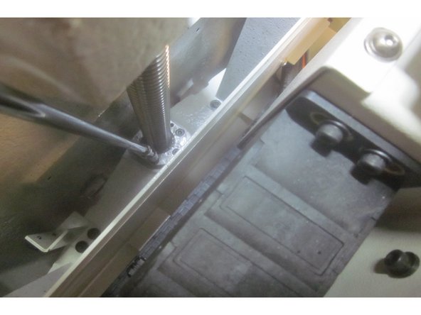 Carefully fit the assembled upper bearing housing onto the end of the ball screw. Lube the threads and install the clamp nut. Torque it to 50 ft. lbs. and the lock screw to 60 in. lbs. Install the lower bearing. It is a precise fit, but may require a light &quot;tap&quot; to seat it against the shoulder on the ball screw.