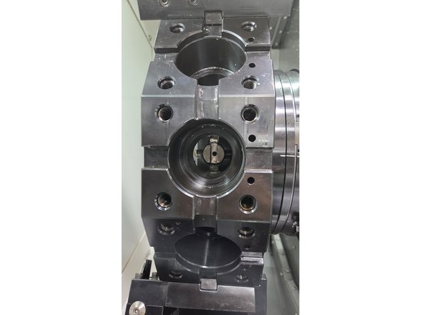 Disable the spindle by pressing SPINDLE STOP (red button on the MCP). Move the spindle by hand so the notch is aligned for smooth live tool changes.