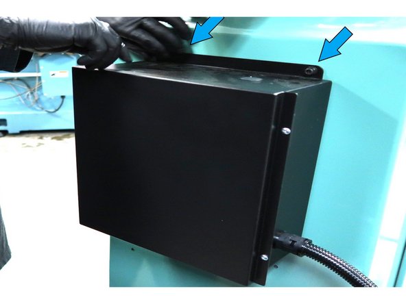 Remove the two top screws and remove the existing electric box with the old motor cable.