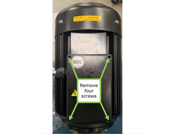 Open the terminal box by removing the four screws around each corner of the terminal box cover.