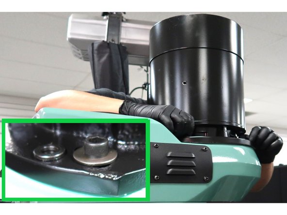 Electrical connections for the motor go on the left side of the machine. Remove the two M8 SHCS holding the bracket to the motor. Attach the spindle belt through the access hole below the motor, slide motor as needed. Slide the motor in position to align with the support holes.