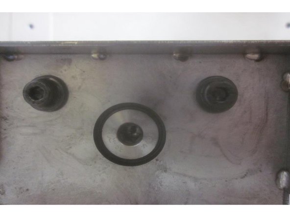 Raise the Z axis to the top. Push the lower ATC carriages forward. Clean all contact surfaces. Install the tool magazine, locating pin and the attaching screws just snug.