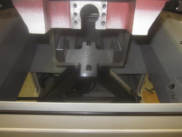 Using a 4mm hex socket, locate and tighten the two (2) set screws that are raising the bridge, and look for shims. Look carefully as they can be stuck to the top or bottom side, out of view. Use a pick or similar, and remove the shims. Back off the set screws when completed. Replace the plastic block when completed.