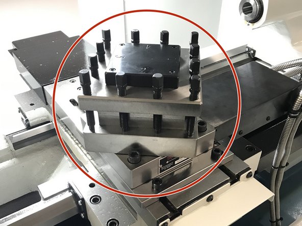 Place turret onto mounting base. Route armor cables underneath bed and exit out the rear of the chip enclosure. Attach air lines, UNCLAMP solenoid cable, INDEX solenoid cable and AIR PRESS cables to regulator assembly, refer to drawing 29640-1. Attach TURRET INPUTS extension cable to cable from turret.