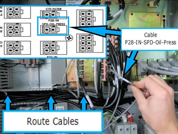 Route sensor cable from the opening at the left of the computer module, second row from the right and third connector from the bottom. Computer module is labeled with &quot;P28-IN-SPD-Oil-Press&quot;. Route cable through wireways when possible.