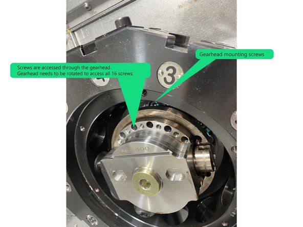 To remove the gearhead there are 16 screws that need to be removed. These screws are accessed through the front of the gearhead. The gearhead needs to be rotated to access all 16 screws. See Photo 2