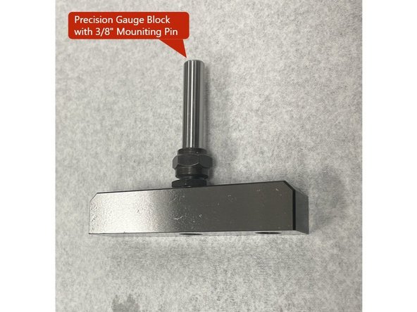 In order to measure the backlash of the VMC2 4th Axis you need to install a precision T-Block with a 3/8 diameter pin for holding it in the collet of the 4th Axis, and install a 0.0001" dial indicator to the spindle. See Photo