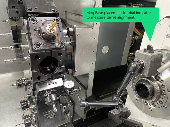 If the center alignment mark (circled in red) doesn't line up with the mark on the right side of the turret assembly (circled in yellow), you will need to remove the Live Tooling Drive motor, Gearhead, and the turret to be able move that back into alignment. See Photo 2