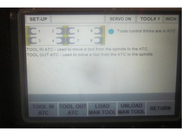 Go to "Tool Loading" and bring the ATC forward. Install a tool holder in the spindle. Note: The door switch needs to be activated to load tools.