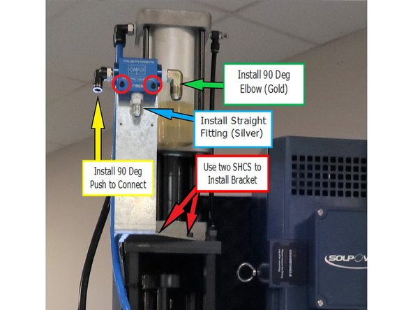 While facing the right side of the machine, install the Shuttle Valve and its bracket on the right side of the sheet metal above the spindle, just above the standoffs.