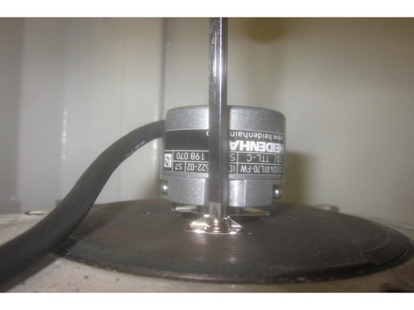 Carefully start the small set screws (1.5mm hex key) into the encoder and slide the encoder onto the shaft until the mounting feet touch the motor housing.