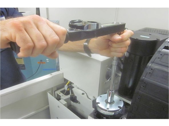 Warning: This step requires working on the machine with the power on. In this step use caution and have the proper sizes of lumber or other suitable material to support the bridge.