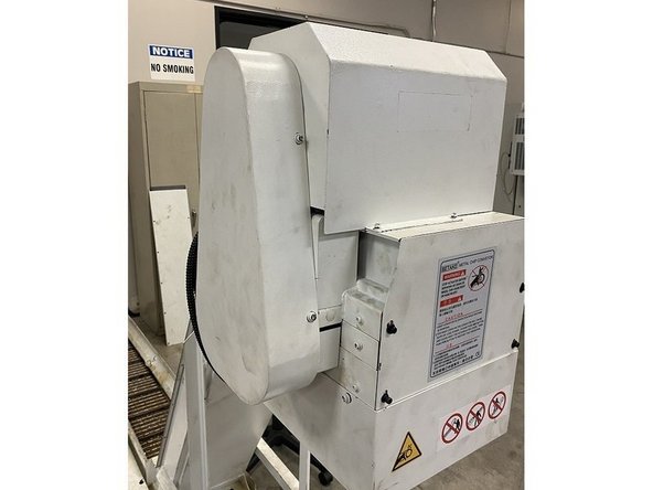 Reinstall all the remaining sheet metal covers that were removed, reinstall the coolant tank and reconnect to machine. Verify operation and return to production.