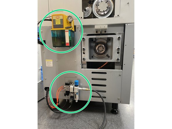 Reinstall the lube pump and the air regulator assembly.