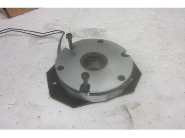 Place the assembly over the ball screw. Install the coupling bushing. Note: The bushing should be a &quot;slip fit&quot; onto the ball screw. If you used a puller to remove it, there might be a burr or nick that's easily cleaned up to correct this. Install the flat washer, star washer, nut and tighten securely. Do not force the bushing on.