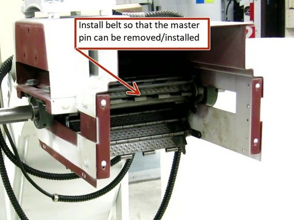 Once the belt has been reinstalled and it is on the top side of the drive sprocket align it so the master pin can be removed. Remove the master pin at this time.