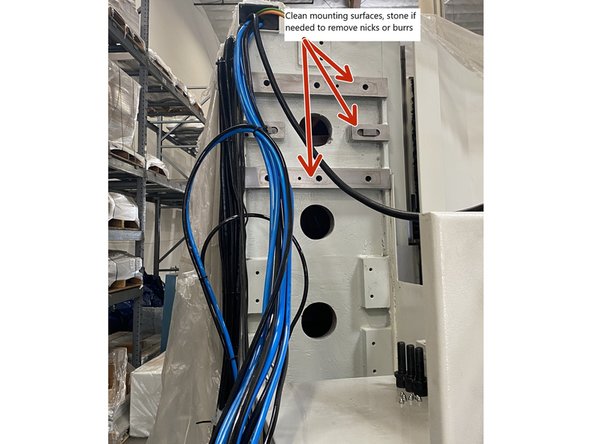 Clean mating surfaces on the machine column and on the ATC mounting bracket.