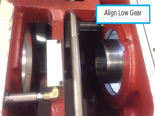 Using the handwheel in DRO slowly move the spindle into the casting until low gear can be installed onto the spindle. Once low gear is on the spindle continue moving the spindle until it gets near the drive key in the spindle, remove the cable tie from low gear and slide low gear over the key.