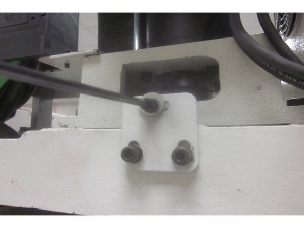 Remove the four (4) 8mm motor mount screws from the motor mount casting. Remove the 5mm belt tension screw from the rear base of the motor.