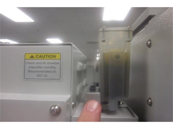 If the spindle performs well and there are no vibration or noise issues, fill the &quot;Clamp / Unclamp&quot; reservoir 3/4's full with ISO 32 oil. Use the oil removed if it's not contaminated.