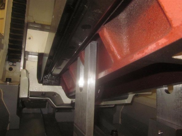 Slowly raise the jack guiding the upper floating &quot;U&quot; shaped plates while capturing the ribs on the bottom of the bridge, just barely contacting the casting (pic). Now tighten up all fasteners, except the shoulder bolts that are attaching the &quot;U&quot; plates to the horizontal plate. These are loose in order to allow for casting variation.