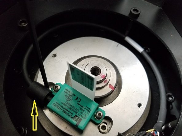 Carefully fit the encoder cable through the grommet and attach to the service box using the same jack screws and nuts. Make sure the DB9 plug is mounted so the ground wire is mounted facing the outside.